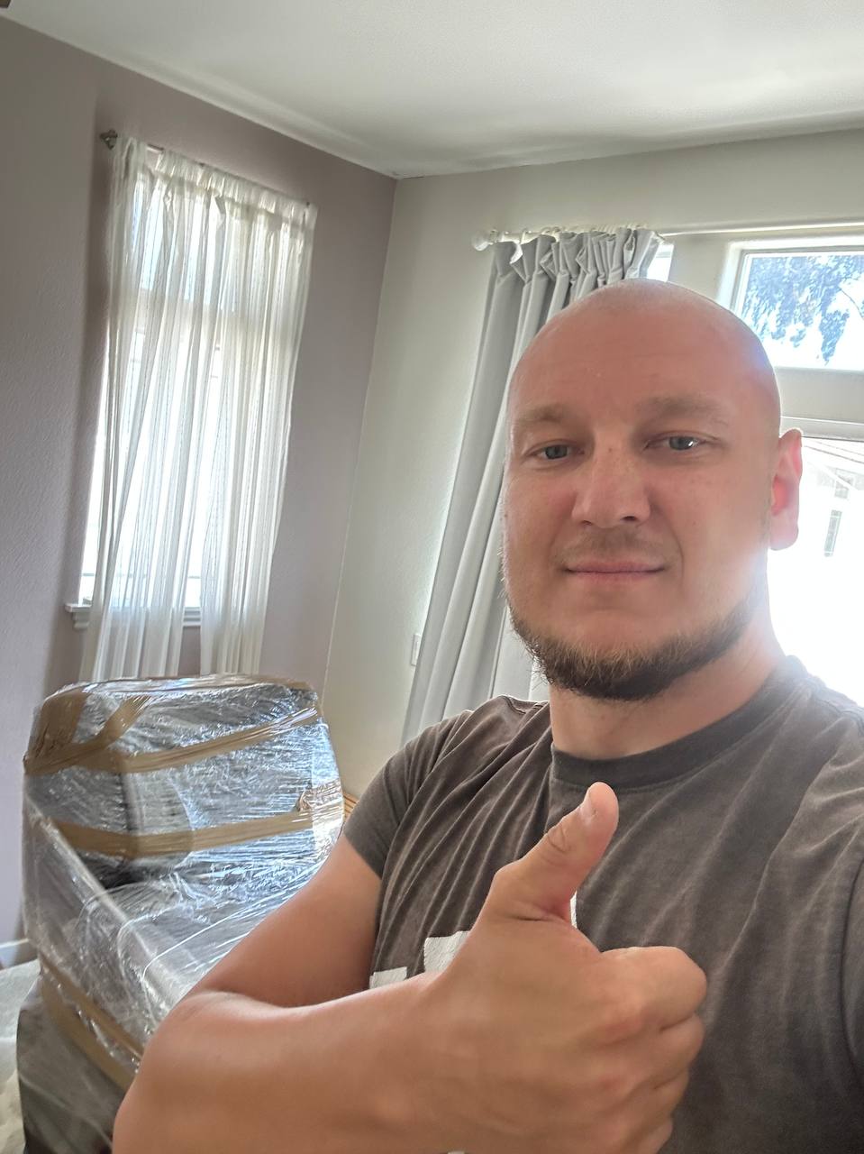 Moving4 founder on a real job — furniture professionally wrapped and protected